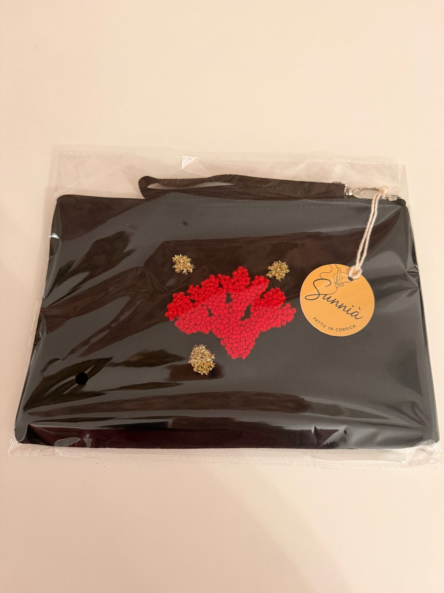 Embroidered pouch – Red coral on black background