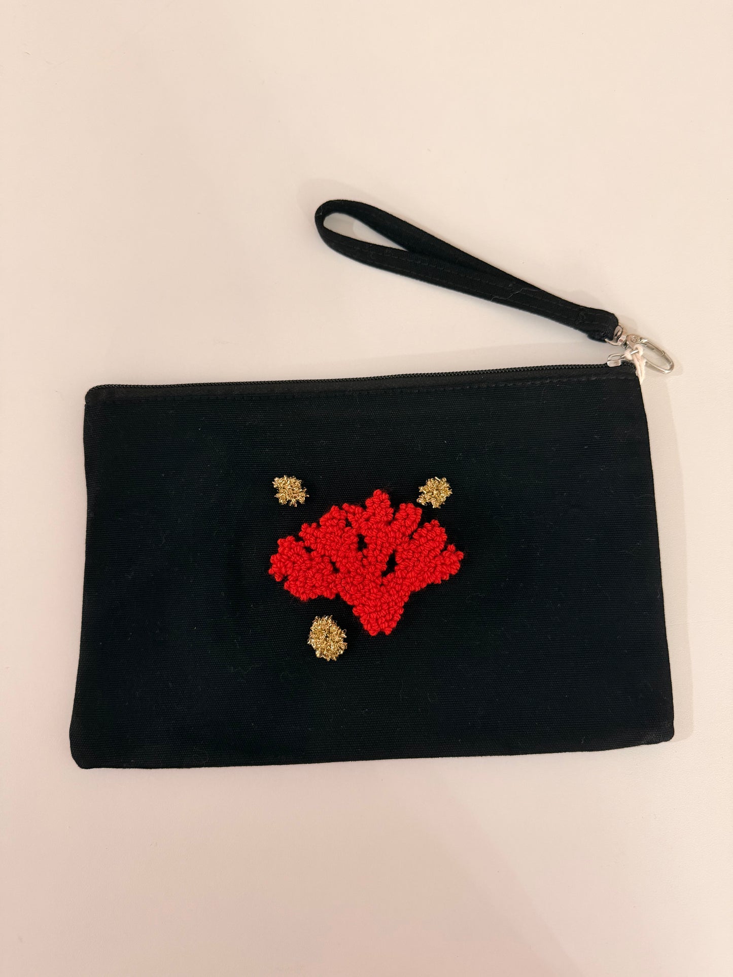 Embroidered pouch – Red coral on black background